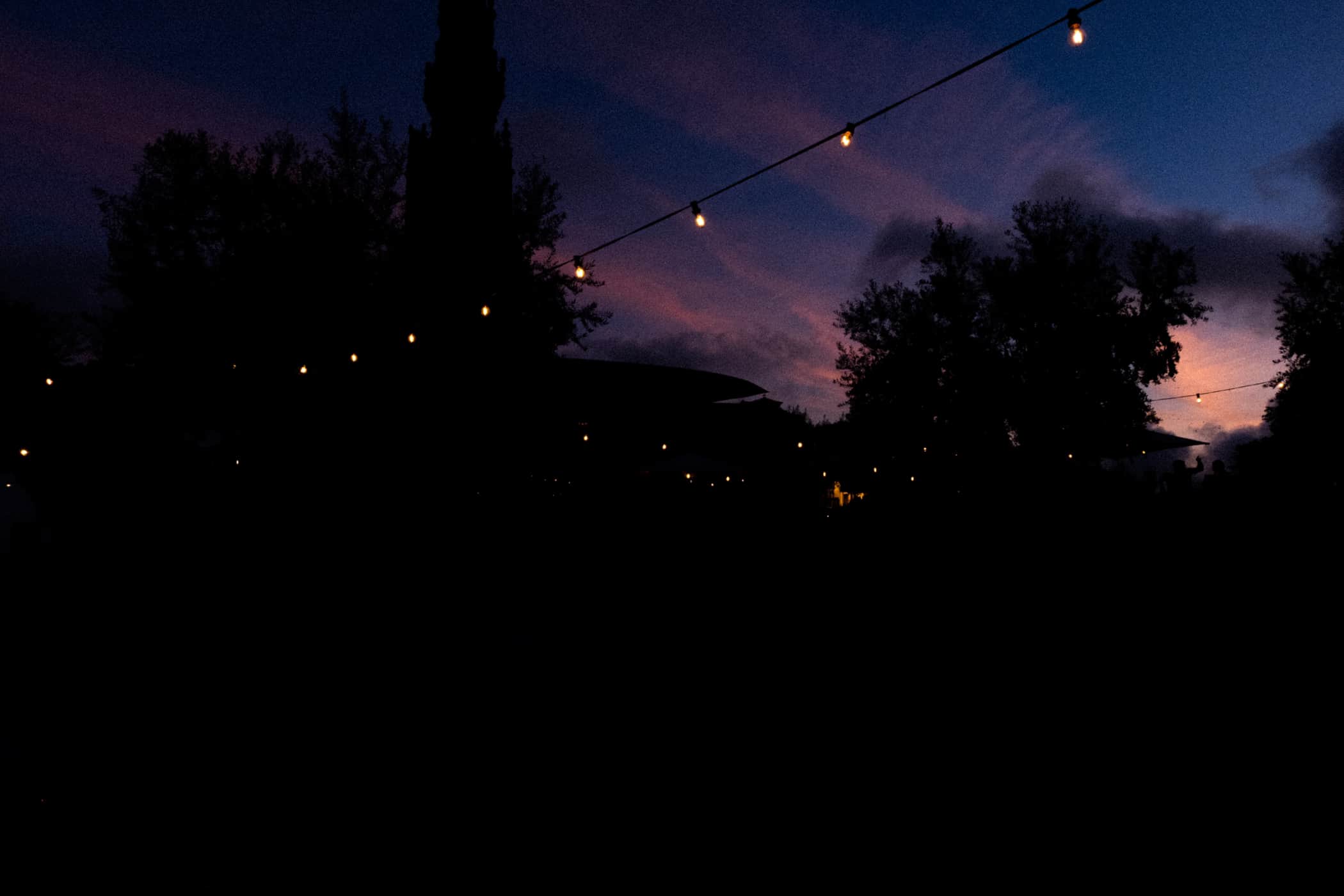 String lights in Porto under a purple evening sky
