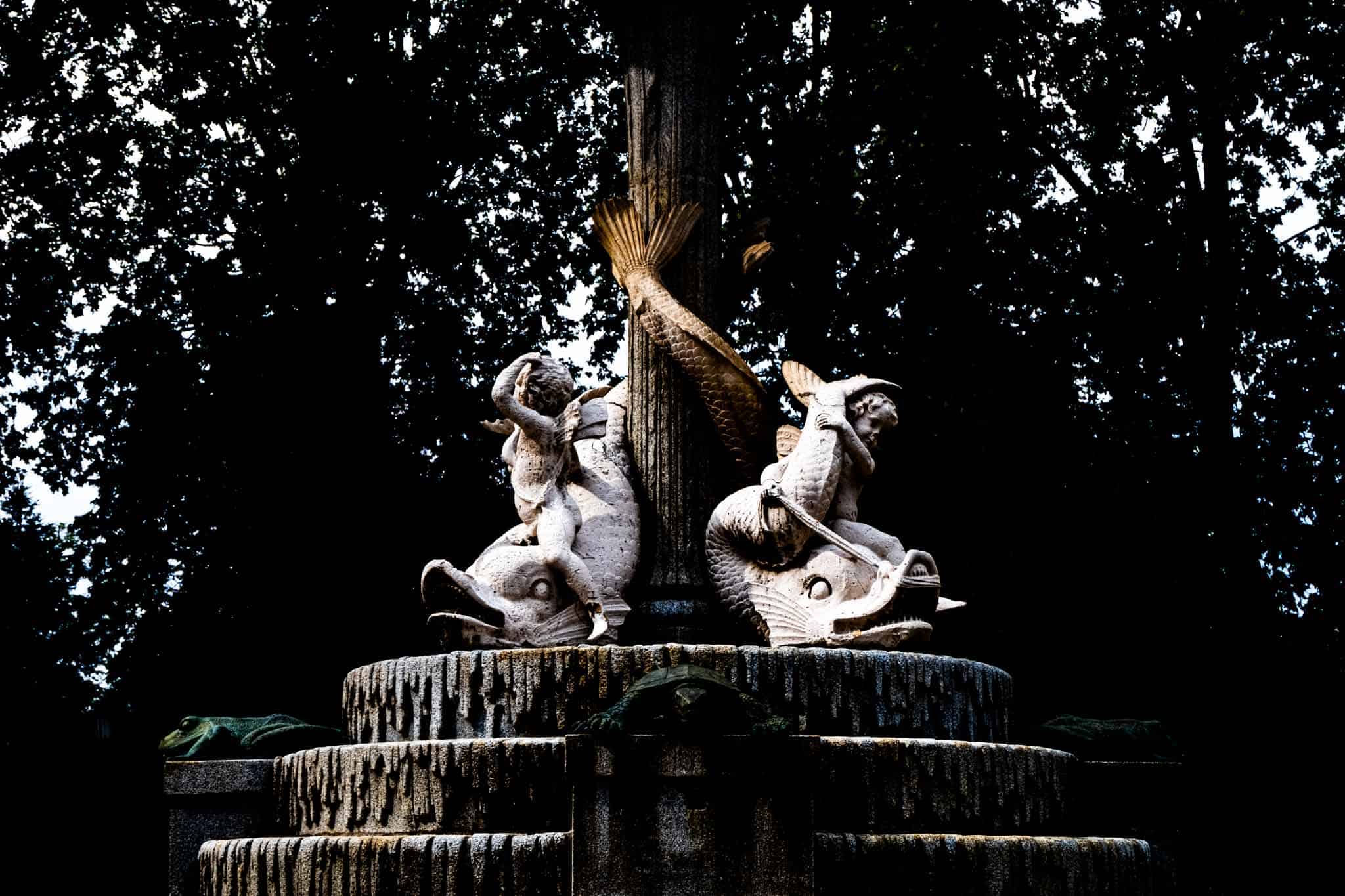 High contrast fountain with statues in Retiro park
