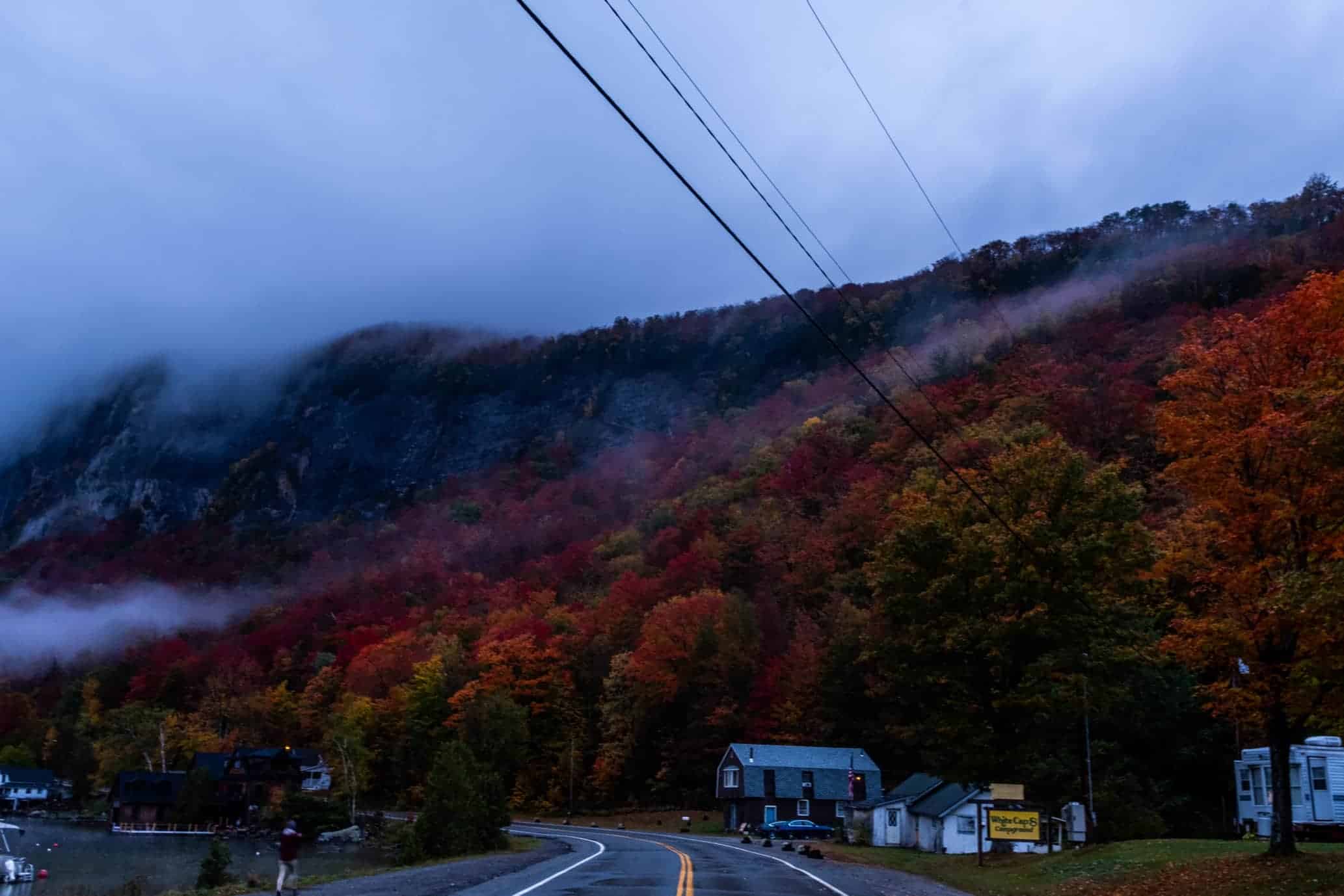 Vermont fall trees and mountain covered in morning fog