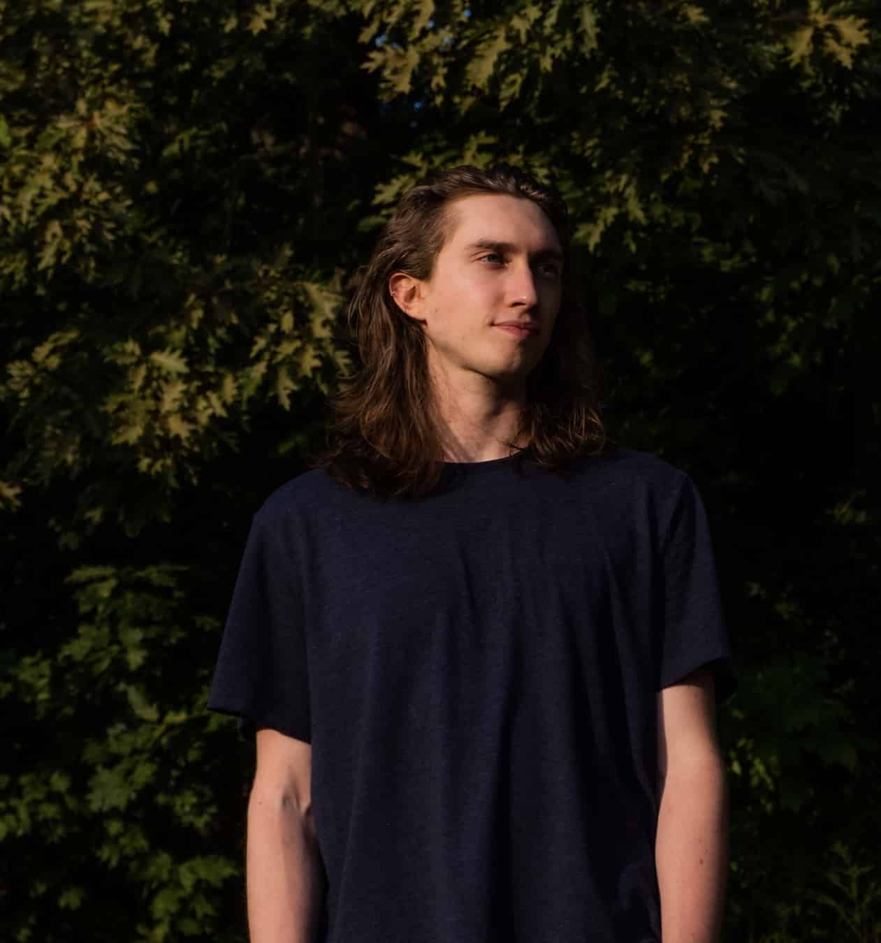 Nik in front of leaves at golden hour